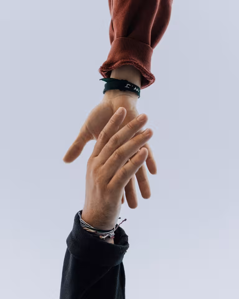 Our mission - hands reaching toward each other